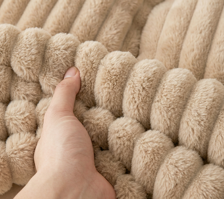 a hand holding blanket