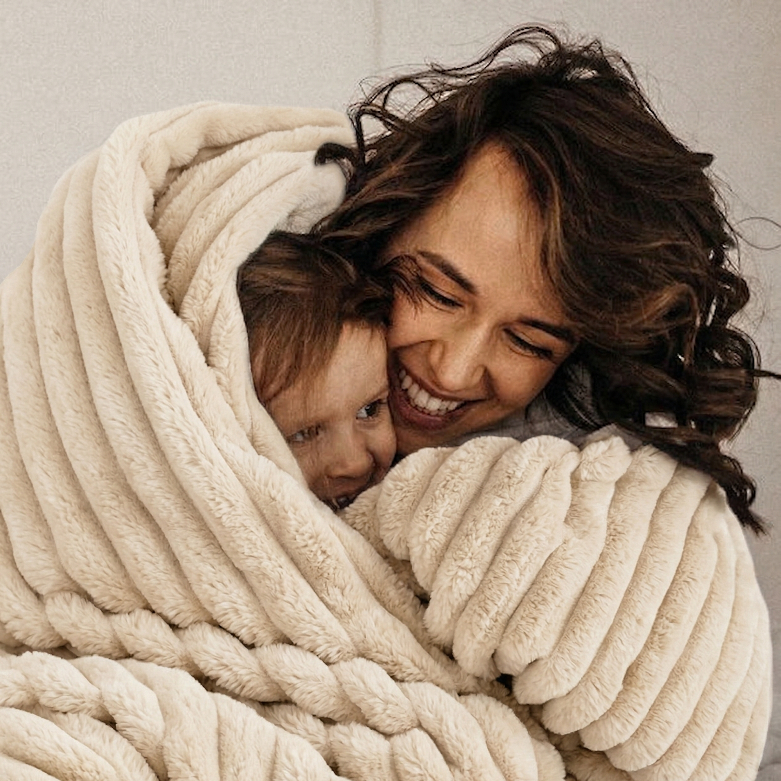 woman with kid in the blanket